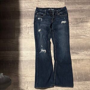 Women's Distressed Blue Jeans